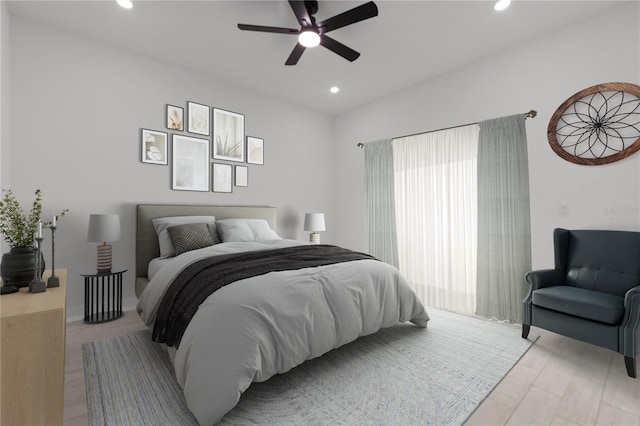 bedroom with ceiling fan and light hardwood / wood-style floors