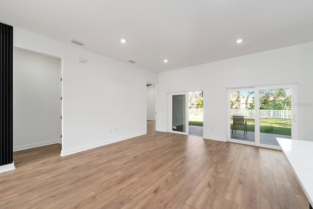 spare room with light hardwood / wood-style floors