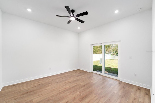 empty room featuring ceiling fan and light hardwood / wood-style floors