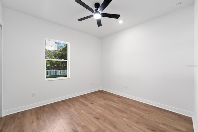 unfurnished room featuring ceiling fan and light hardwood / wood-style flooring