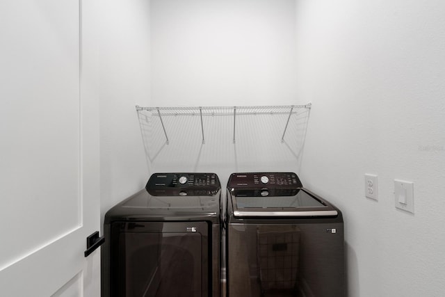 laundry area featuring washing machine and dryer