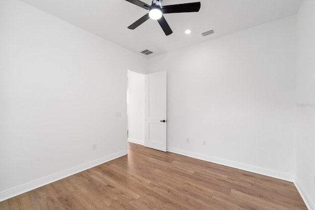 spare room featuring ceiling fan and light hardwood / wood-style floors