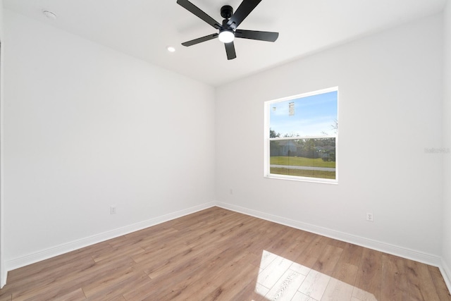 spare room featuring ceiling fan and light hardwood / wood-style flooring