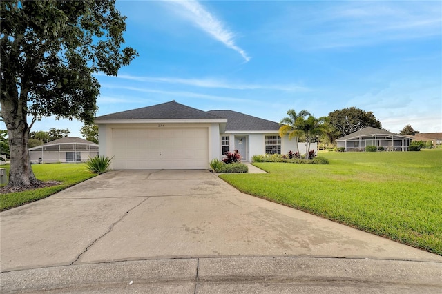 ranch-style home with a front lawn, a garage, and glass enclosure