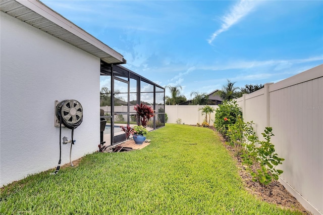 view of yard featuring glass enclosure