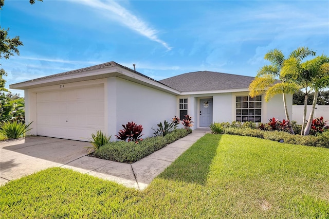 ranch-style home featuring a garage and a front yard