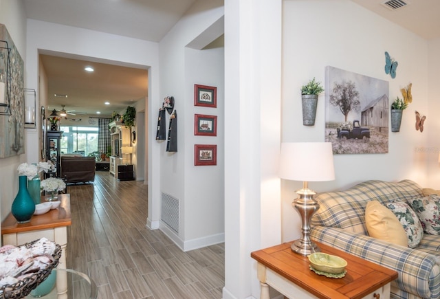 hallway featuring hardwood / wood-style flooring