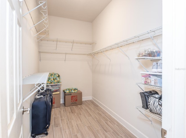 walk in closet featuring hardwood / wood-style flooring