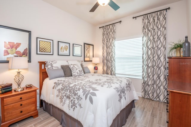 bedroom featuring light hardwood / wood-style floors and ceiling fan