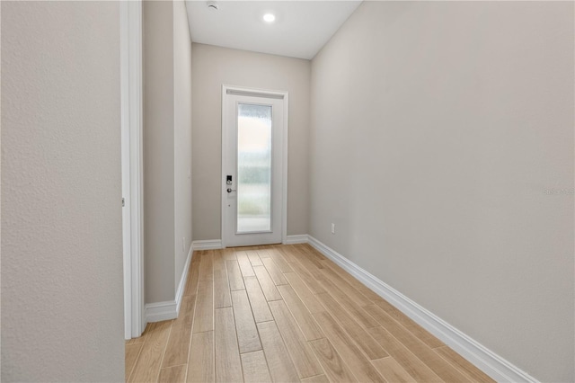 doorway to outside with light hardwood / wood-style floors