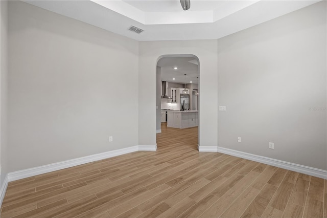 spare room with light hardwood / wood-style floors