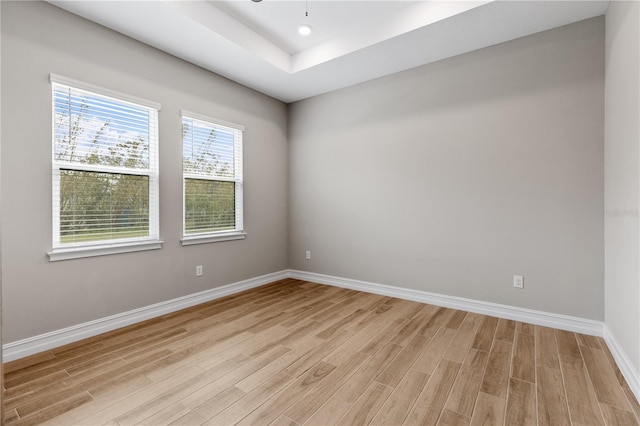 spare room featuring light hardwood / wood-style flooring