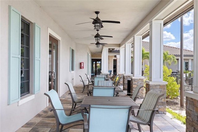 view of patio featuring ceiling fan