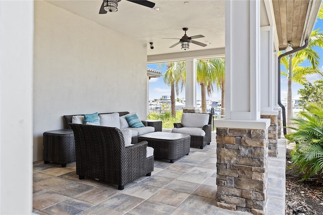 view of patio with outdoor lounge area and ceiling fan