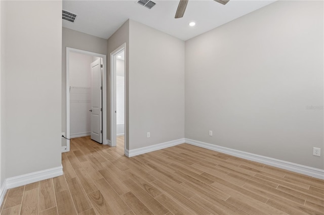 unfurnished room featuring light hardwood / wood-style flooring and ceiling fan