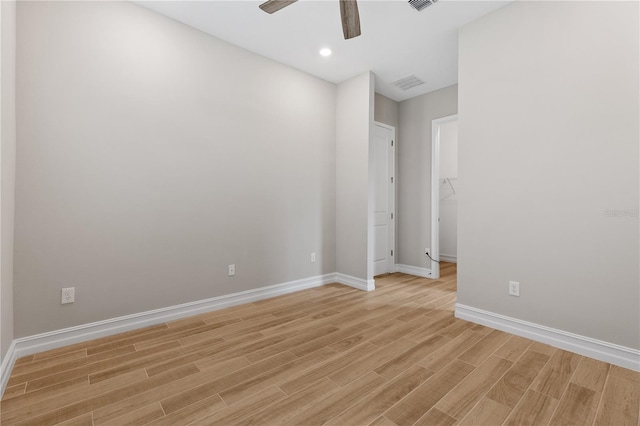 unfurnished room with ceiling fan and light hardwood / wood-style floors