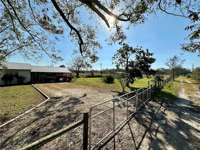 view of yard with a rural view