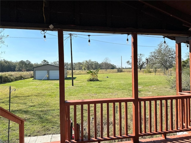 view of yard featuring an outbuilding and a garage