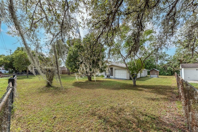 view of yard featuring a garage