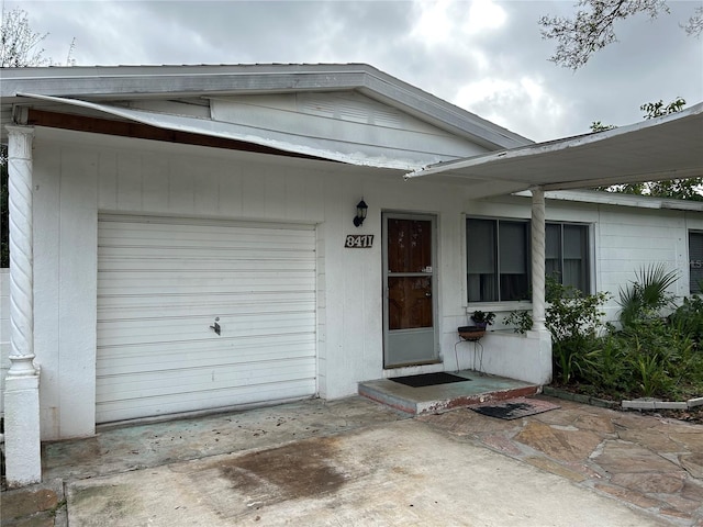 property entrance with a garage