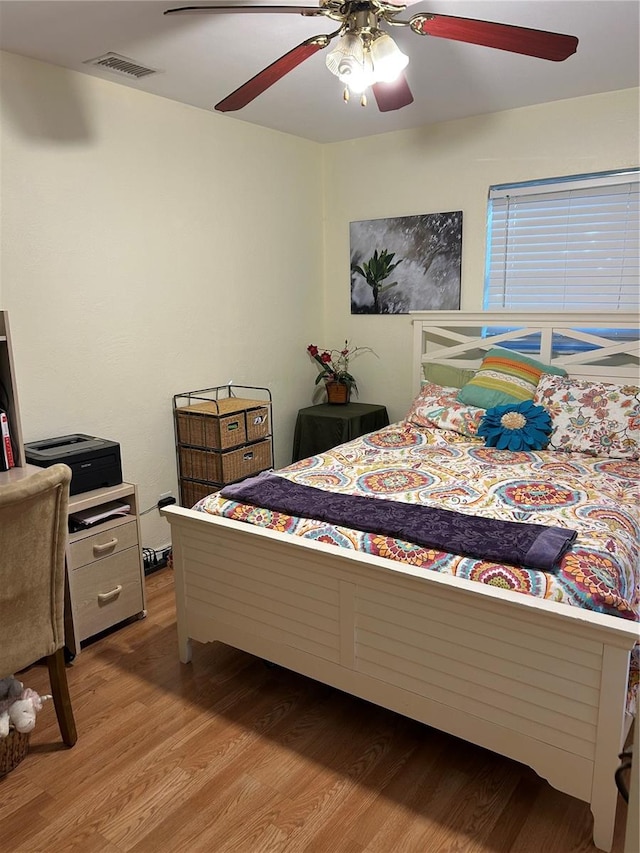 bedroom featuring ceiling fan and light hardwood / wood-style flooring