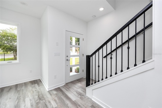 3402 E 28th Ave Unit 1, Tampa, FL 33605 - entryway with stairway, wood finished floors, baseboards, and recessed lighting