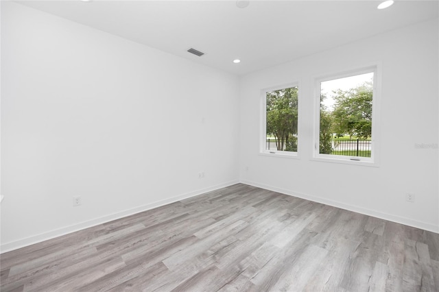 spare room with light hardwood / wood-style flooring