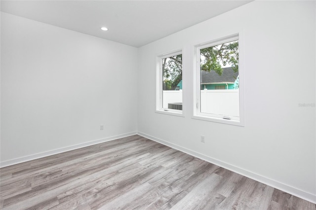 spare room with light wood-type flooring