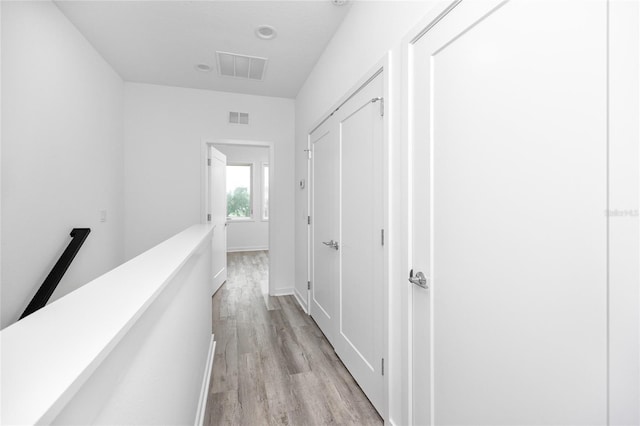 corridor featuring light hardwood / wood-style floors