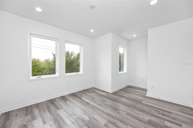 spare room with light wood-type flooring