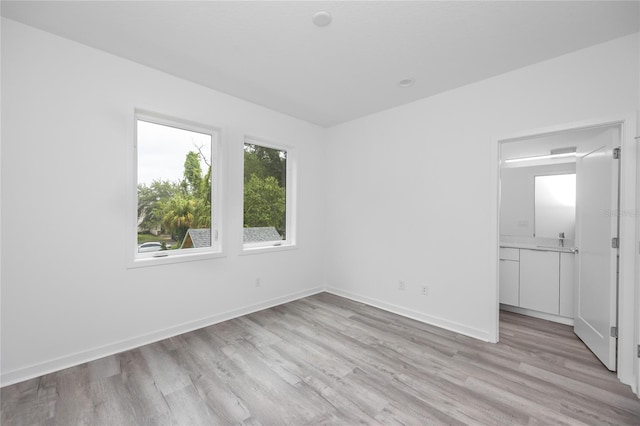 unfurnished room featuring light hardwood / wood-style flooring