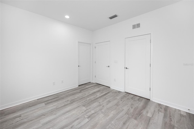 unfurnished bedroom with light hardwood / wood-style flooring