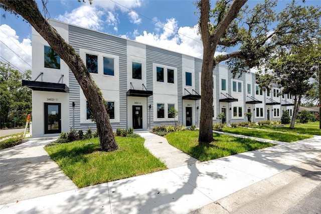3402 E 28th Ave Unit 1, Tampa, FL 33605 - multi unit property featuring stucco siding and a front yard