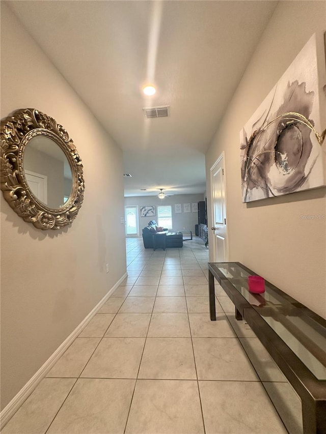 hall with light tile patterned flooring