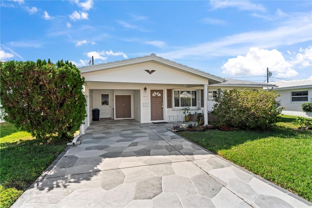 single story home with a carport and a front yard