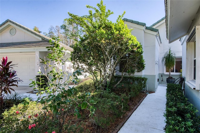 view of property exterior with a garage