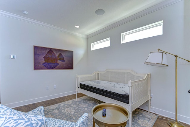 bedroom with dark hardwood / wood-style floors and ornamental molding