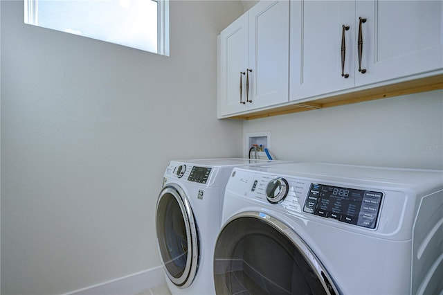 laundry area with cabinets and independent washer and dryer