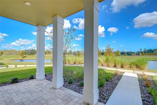 view of patio / terrace featuring a water view