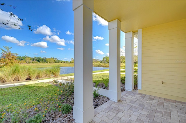 view of patio / terrace featuring a water view