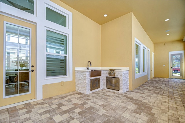 view of patio / terrace with sink and exterior kitchen