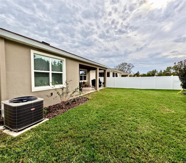 view of yard with a patio and central AC