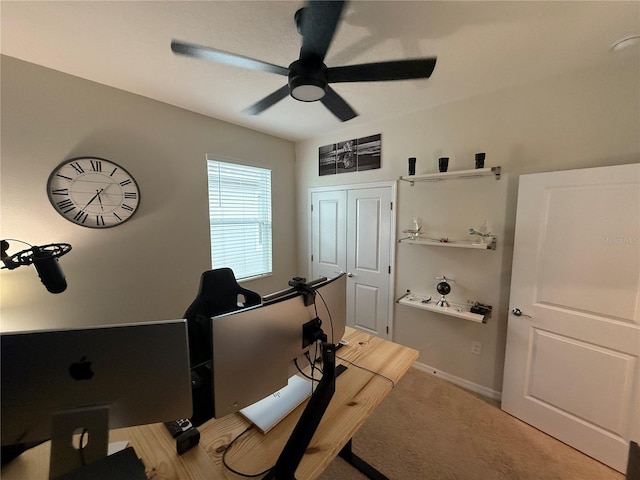 workout room with carpet floors and ceiling fan