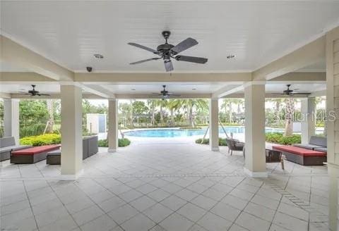 view of patio featuring ceiling fan