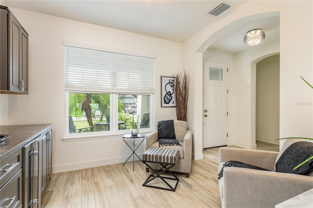 sitting room with light hardwood / wood-style flooring