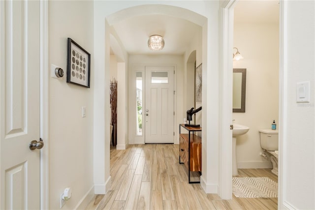 entryway with light hardwood / wood-style floors