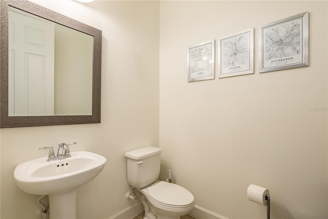 bathroom featuring sink and toilet