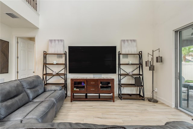 living room with light hardwood / wood-style flooring