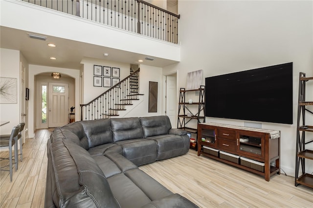 living room featuring a high ceiling