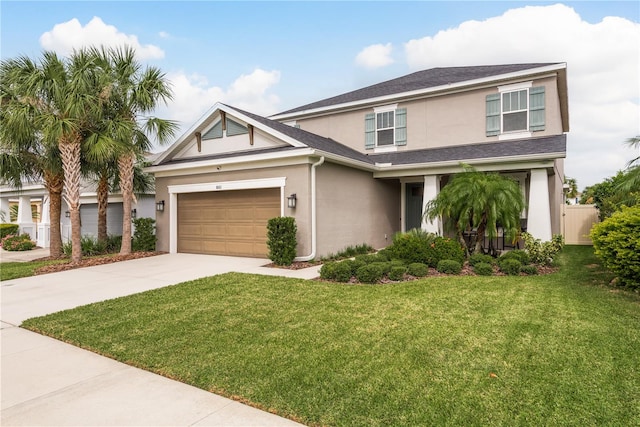 view of front of property with a garage and a front lawn